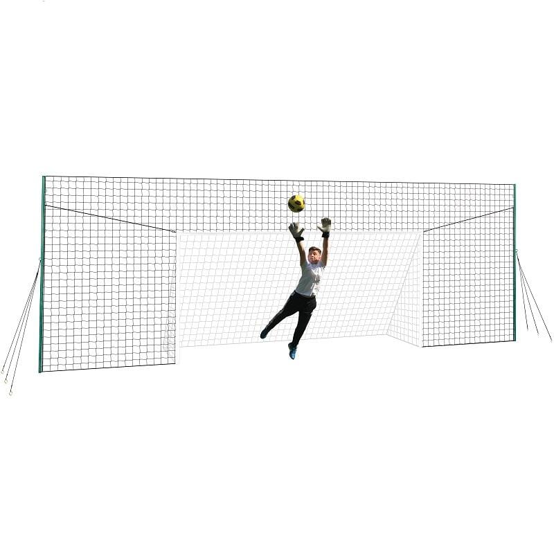 Child scoring into a football goal for the garden with rebound net
